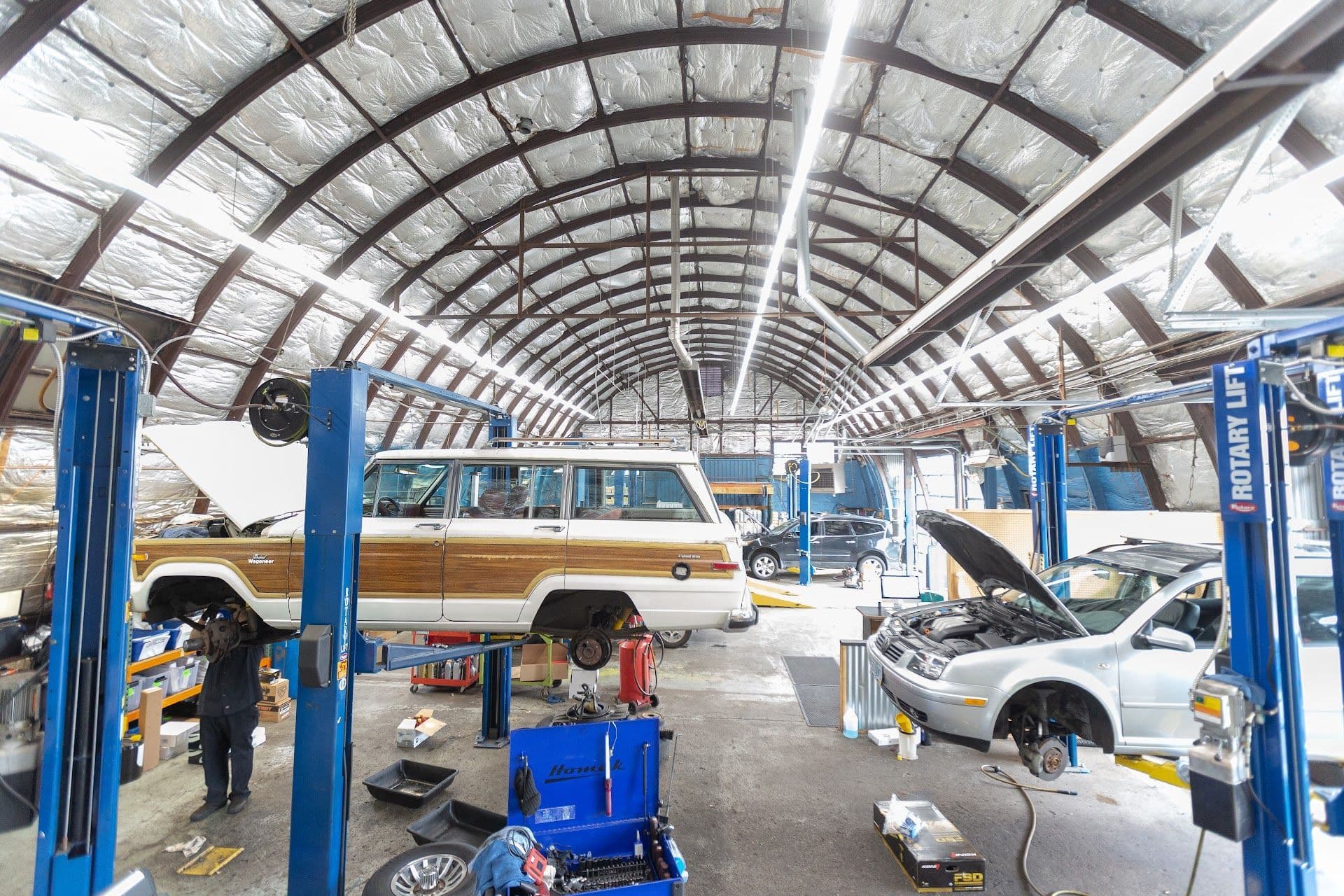 Mechanics working on vehicle